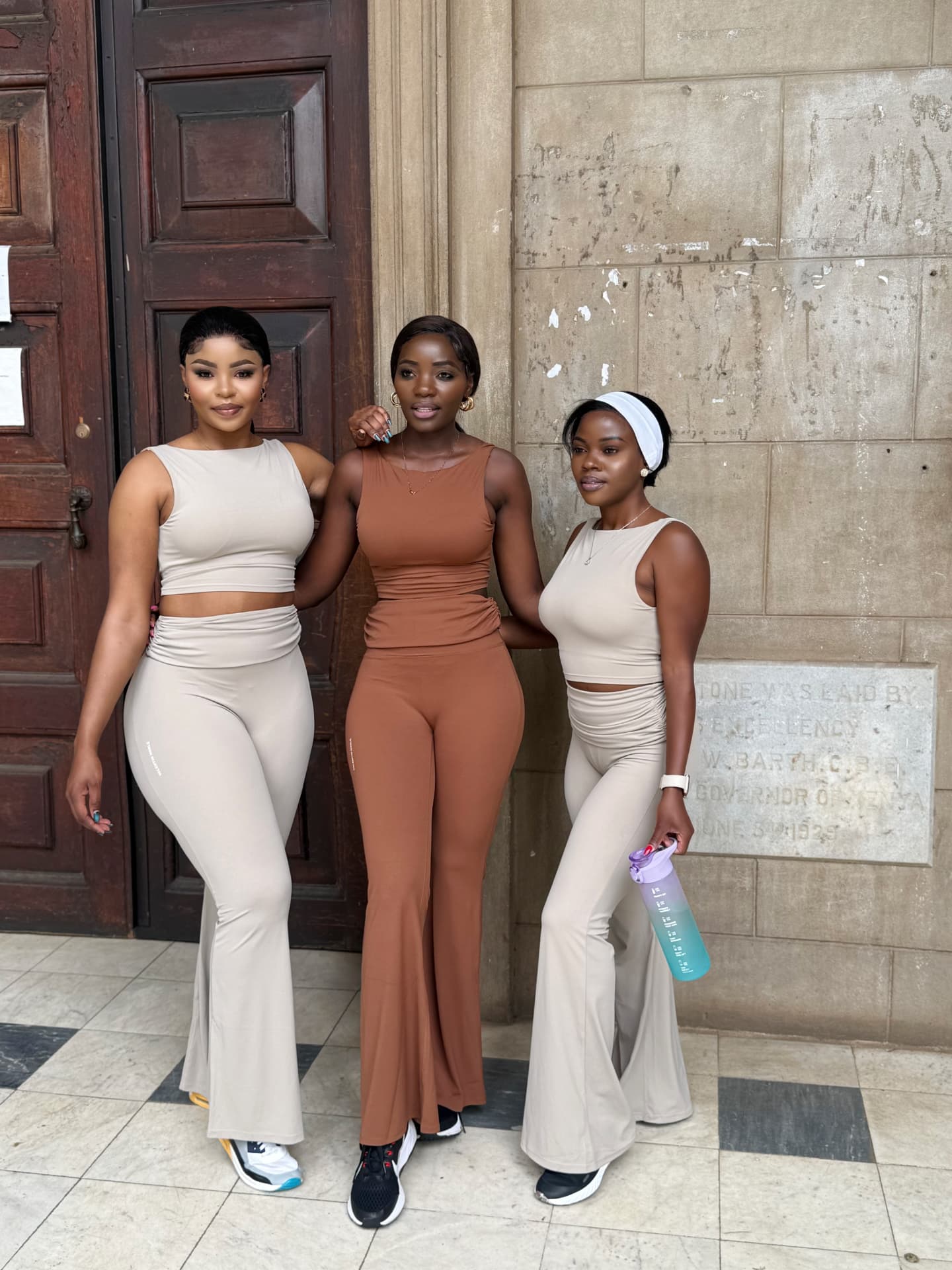 Three women wearing Valentin Noble flared activewear sets
