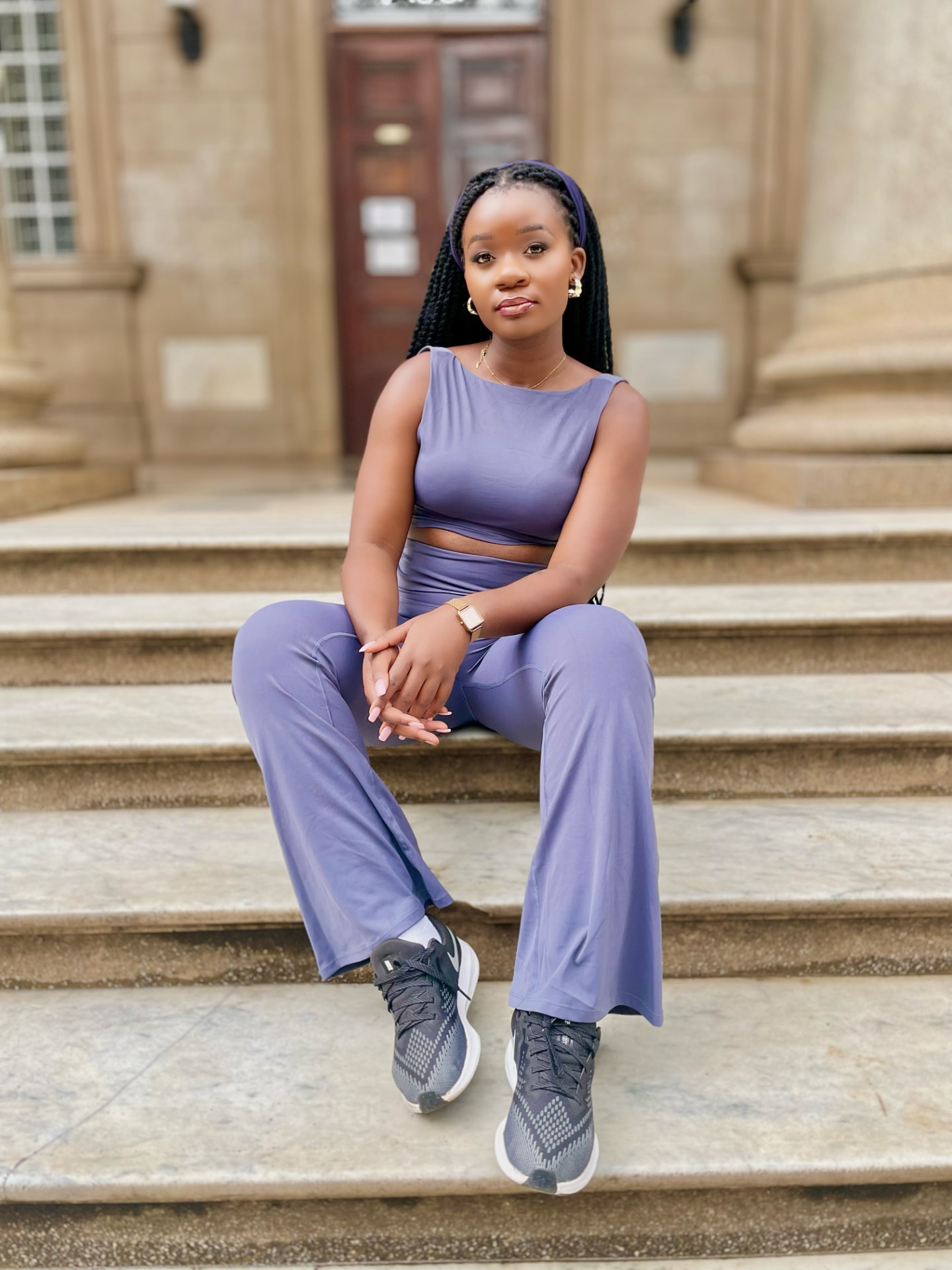 Woman wearing a lilac cropped top and wide-leg trousers